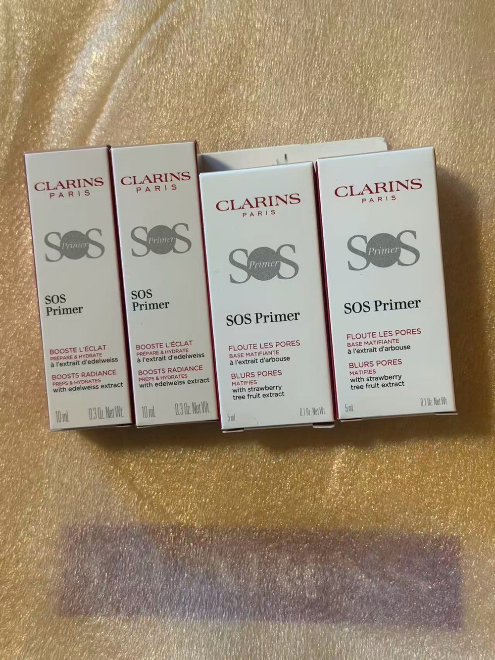 Clarins White SOS Primer Boxes with Burgundy Accents 30ml total
